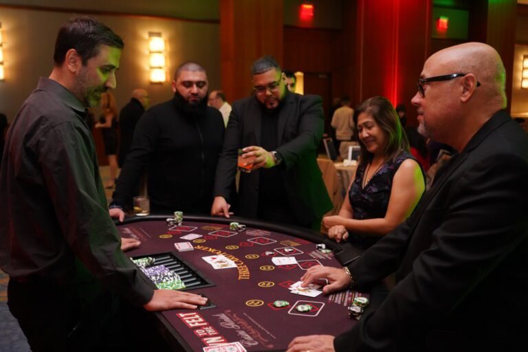 Three card poker table with chips and prizes at a holiday casino party