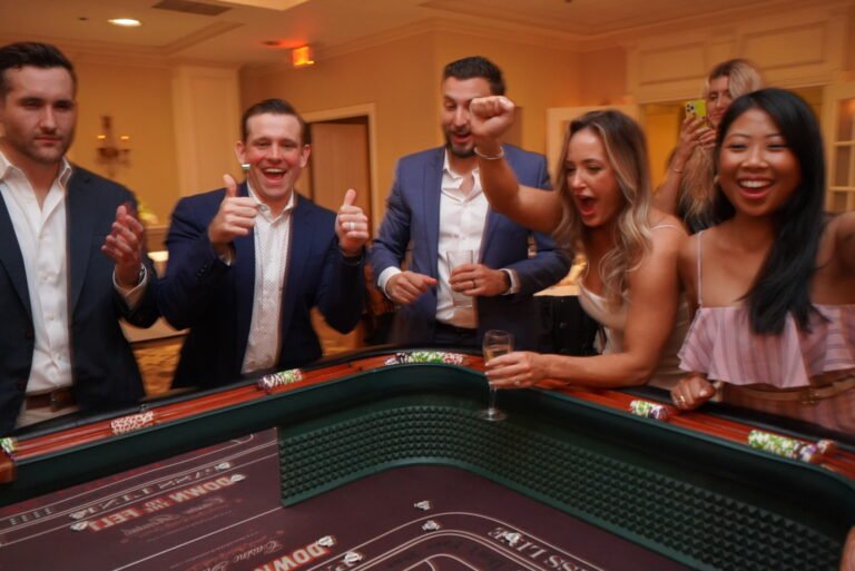 Guests playing casino table games at a corporate event