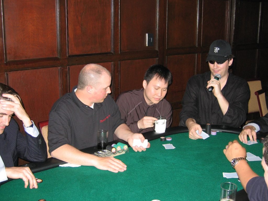 Phil Hellmuth playing Texas Hold'em with corporate guests at a Down to the Felt poker night in NYC